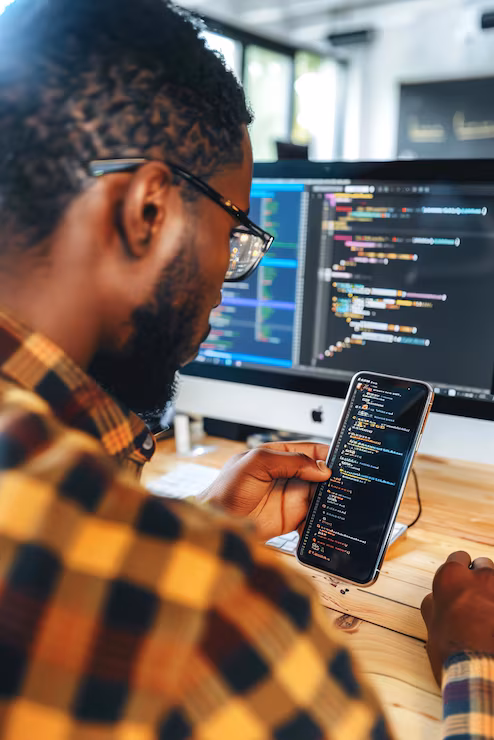 Mobile app interfaces being designed on screen